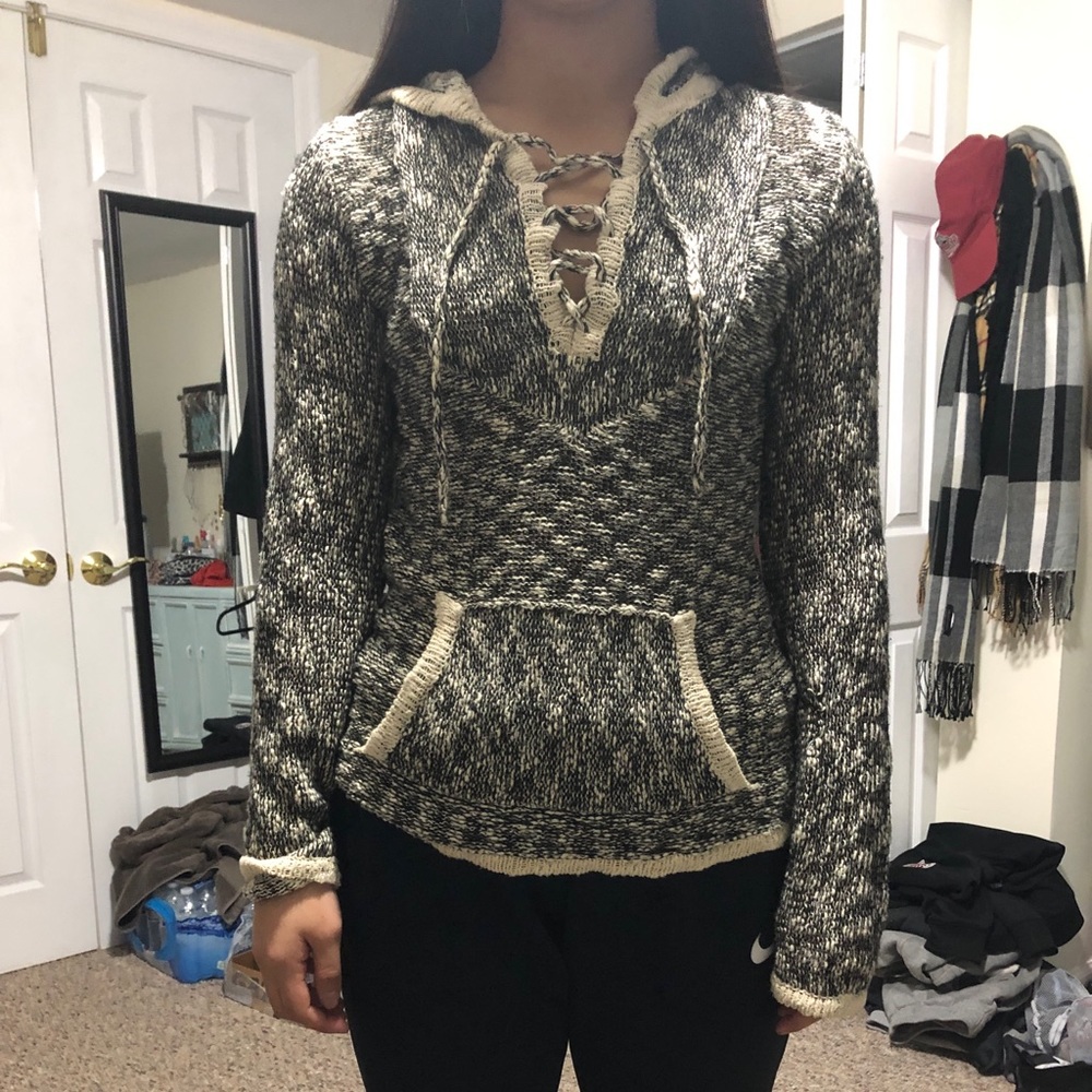 A black and cream sweater.